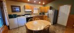 Kitchen is equipped with an electric range, washer and dryer, drip coffee pot, toaster, microwave and full size fridge. 